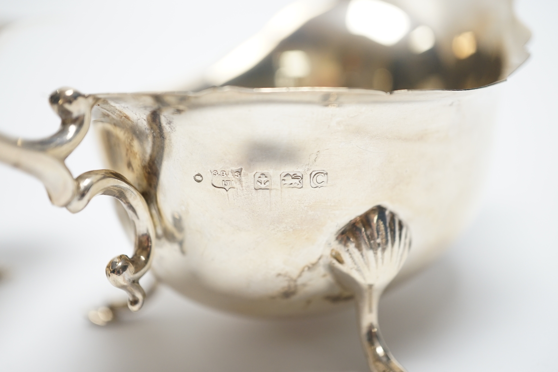A pair of George V silver sauceboats, with flying scroll handles, S. Blanckensee & Sons Ltd, Birmingham, 1927, length 15cm, 4.7oz.